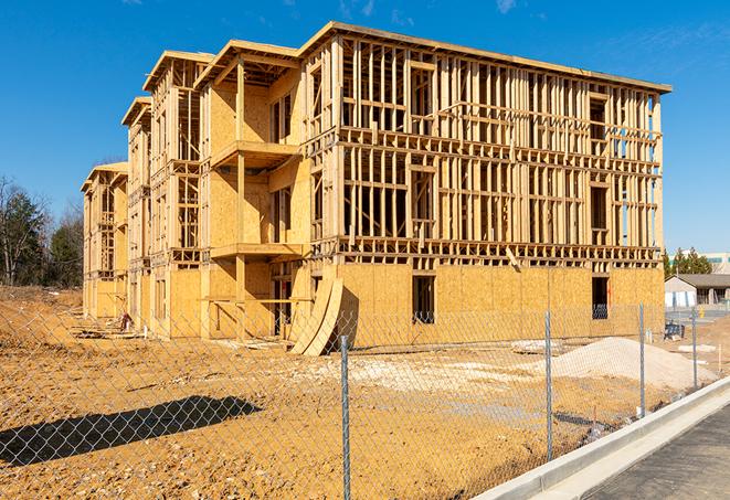 a close-up of temporary chain link fences enclosing a construction site, signaling progress in the project's development in Arnaudville LA